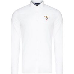 Koszula AERONAUTICA MILITARE Biały. Białe koszule męskie marki Aeronautica Militare, bez wzorów, z bawełny, bez kołnierzyka, bez rękawów. Za 480,00 zł.