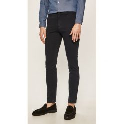 Tommy Hilfiger - Spodnie. Brązowe spodnie męskie TOMMY HILFIGER, na co dzień, bez wzorów, z elastanu, casualowe. Za 499,90 zł.