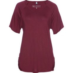 Shirt z wycięciami na ramionach bonprix czerwony rododendron. Fioletowe koszulki damskie bonprix, w koronkowe wzory, z koronki, bez kołnierzyka, bez rękawów. Za 79,99 zł.