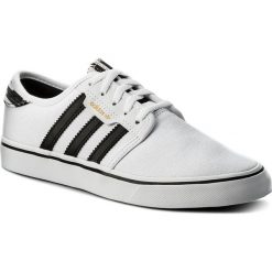 Buty adidas - Seeley CQ1175 Ftwwht/Cblack/Ftwwht. Białe buty sportowe damskie Adidas, na imprezę, w paski, ze skóry ekologicznej, bez obcasa, na płaskiej podeszwie, z paskami. W wyprzedaży za 229,00 zł.