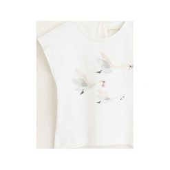 Mango Kids - Top dziecięcy Ocas 80-104 cm. Białe bluzki dziewczęce marki Mango Kids, z nadrukiem, z bawełny, z okrągłym kołnierzem, z krótkim rękawem, krótkie, bez kaptura. Za 35,90 zł.
