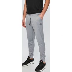 The North Face - Spodnie. Szare spodnie męskie The North Face, s, bez wzorów, z poliesteru, sportowe. W wyprzedaży za 229,90 zł.