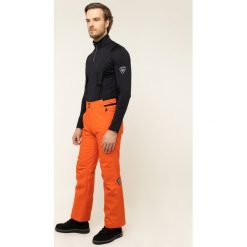 Spodnie narciarskie Rossignol Ski Ski RLIMP03. Pomarańczowe spodnie męskie Rossignol, s, bez wzorów, z poliesteru, sportowe. W wyprzedaży za 389,00 zł.