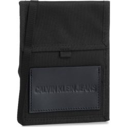 Saszetka CALVIN KLEIN JEANS - Sport Essentials Pass Laynard K50K504533 001. Czarne torby męskie skórzane marki Calvin Klein Jeans, bez wzorów, z jeansu, młodzieżowe. Za 139,00 zł.