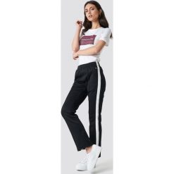 Calvin Klein Spodnie Side Stripe Track - Black. Czarne bryczesy damskie Calvin Klein. Za 526,95 zł.