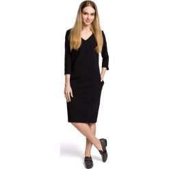 Sukienka Codzienna Dzianinowa z Dekoltem w Szpic - Czarna. Czarne sukienki dzianinowe marki Molly.pl, na co dzień, l, sportowe, dekolt w kształcie v, midi, oversize. Za 124,90 zł.