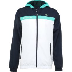 Lacoste Sport TENNIS JACKET Kurtka sportowa navy blue/white/papeete. Niebieskie kurtki sportowe męskie marki Lacoste Sport, m, z materiału. Za 629,00 zł.