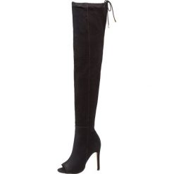 Buffalo Kozaki na obcasie jeans black. Czarne kozaki damskie marki Buffalo, z jeansu, na obcasie. W wyprzedaży za 356,15 zł.