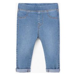 Mango Kids - Jeansy dziecięce Nora 80-98 cm. Niebieskie jeansy dziewczęce marki Mango Kids, z bawełny. W wyprzedaży za 29,90 zł.