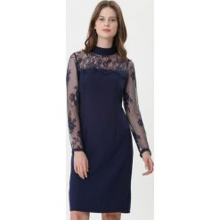 Ciemnoniebieska Sukienka Pretty Unique. Niebieskie sukienki damskie Born2be, na zimę, s, bez wzorów, z tkaniny, bez kołnierzyka, bez rękawów, mini. Za 79,99 zł.