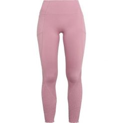 Free People TIME IS NOW SMOCKED Legginsy mulberry. Czerwone spodnie damskie marki Free People, s, z elastanu. Za 409,00 zł.
