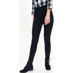 LEGGINSY DAMSKIE, Z WIĄZANIEM. Czarne legginsy marki TROLL, s. W wyprzedaży za 69,99 zł.