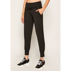 Spodnie dresowe Puma Studio Yogini Luxe 519514. Czarne spodnie damskie Puma, xs, z dresówki. Za 249,99 zł.