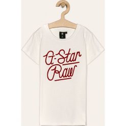 G-Star Raw - T-shirt dziecięcy 128-164 cm. Białe bluzki dziewczęce G-Star RAW, z aplikacjami, z bawełny, z okrągłym kołnierzem, z krótkim rękawem, krótkie, bez kaptura. Za 129,90 zł.