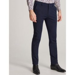 Bawełniane chinosy slim - Granatowy. Niebieskie spodnie męskie Reserved, m, z bawełny. Za 129,99 zł.