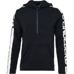 J.LINDEBERG COLIN DOUBLE MELANGE Bluzka z długim rękawem navy. Niebieskie koszulki męskie marki J.LINDEBERG, xl, bez wzorów, z poliesteru, bez kołnierzyka, z długim rękawem, długie. Za 509,00 zł.