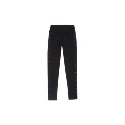 Spodnie damskie legginsy z dżetami. Czarne legginsy TXM. Za 29,99 zł.