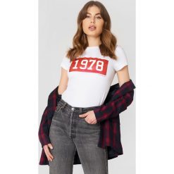 Calvin Klein T-shirt Tamar-50 Crew Neck - White. Białe t-shirty damskie marki Calvin Klein, z nadrukiem, z dzianiny. Za 202,95 zł.