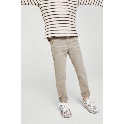 Mango Kids - Jeansy dziecięce Sergio 104-164 cm. Niebieskie jeansy męskie marki Mango Kids, z bawełny. W wyprzedaży za 49,90 zł.