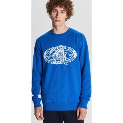 Bluza Baltic Games - Niebieski. Niebieskie bluzy męskie Cropp, s. W wyprzedaży za 39,99 zł.