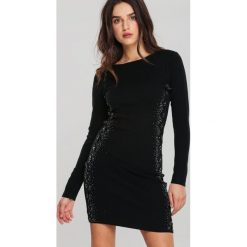 Czarna Sukienka Macquarie. Czarne sukienki damskie Renee, xl, z aplikacjami, z dzianiny, długie, mini, dopasowane. Za 89,99 zł.