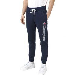 Champion Spodnie dresowe Niebieski. Niebieskie spodnie męskie Champion, s, z haftami, z bawełny. Za 240,95 zł.