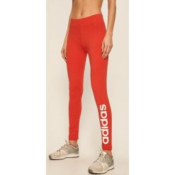 Adidas - Legginsy. Czerwone spodnie damskie Adidas, s, z nadrukiem, z elastanu. Za 119,90 zł.