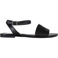 Armani Exchange Sandały Czarny. Czarne sandały damskie Armani Exchange, w paski, z materiału, bez obcasa, z paskami. Za 619,95 zł.