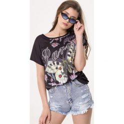 Czarna Bluzka Milestone. Czarne bluzki damskie Born2be, xl, z nadrukiem, klasyczne, z okrągłym kołnierzem, z krótkim rękawem. Za 39,99 zł.