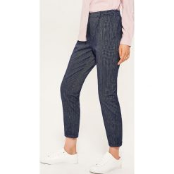 Materiałowe spodnie chino - Granatowy. Niebieskie chinosy damskie House, z materiału. Za 49,99 zł.