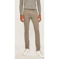Tommy Hilfiger - Spodnie. Zielone spodnie męskie TOMMY HILFIGER, na co dzień, bez wzorów, z elastanu, casualowe. Za 429,90 zł.
