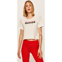 Guess Jeans - T-shirt. Czarne bluzki damskie Guess Jeans, s, z nadrukiem, z bawełny, casualowe, z okrągłym kołnierzem. W wyprzedaży za 89,90 zł.