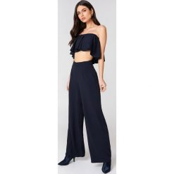 Linn Ahlborg x NA-KD Szerokie spodnie - Navy. Niebieskie spodnie z wysokim stanem marki Linn Ahlborg x NA-KD, z poliesteru. Za 161,95 zł.