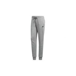 Spodnie treningowe adidas Spodnie z mankietami Essentials Logo. Szare bryczesy damskie marki Adidas, m. Za 169,00 zł.