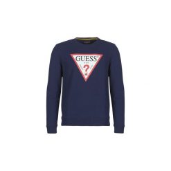 Bluzy Guess JARED. Niebieskie bluzy męskie marki Guess, s, z aplikacjami, bez kołnierzyka, bez rękawów, bez kaptura. Za 309,00 zł.