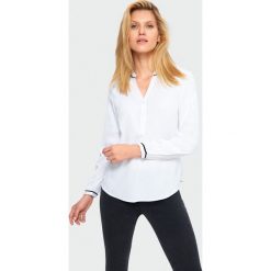 Bluzka z ozdobną lamówką. Bluzki damskie Greenpoint, z poliesteru. Za 39,99 zł.
