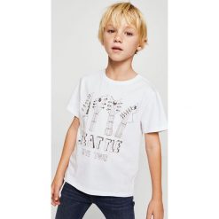 Mango Kids - T-shirt dziecięcy Tour 104-164 cm. Szare t-shirty chłopięce marki Mango Kids, z nadrukiem, z bawełny, z okrągłym kołnierzem. W wyprzedaży za 15,90 zł.