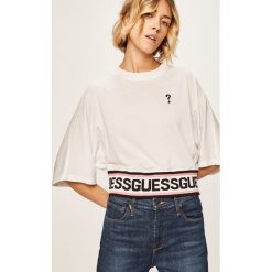 Guess Jeans - T-shirt. Czarne bluzki damskie Guess Jeans, s, z aplikacjami, z bawełny, z okrągłym kołnierzem. Za 239,90 zł.