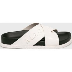 Melissa - Klapki. Białe klapki damskie Melissa, bez wzorów, z gumy, bez obcasa, na obcasie. W wyprzedaży za 299,90 zł.