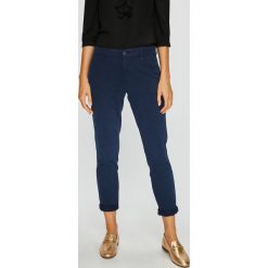 Tommy Jeans - Spodnie. Niebieskie spodnie damskie Tommy Jeans, bez wzorów, z elastanu, casualowe. W wyprzedaży za 249,90 zł.