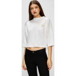 Puma - Top. Białe bluzki damskie Puma, s, z nadrukiem, z bawełny, z okrągłym kołnierzem. W wyprzedaży za 129,90 zł.
