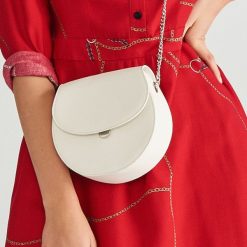 Torebka typu saddle bag - Kremowy. Białe torebki klasyczne damskie marki Reserved, bez wzorów, bez dodatków. Za 59,99 zł.