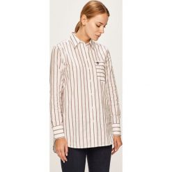 Tommy Hilfiger - Koszula. Białe bluzki damskie TOMMY HILFIGER, na co dzień, bez wzorów, z bawełny, klasyczne, z klasycznym kołnierzykiem, z długim rękawem. W wyprzedaży za 269,90 zł.