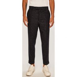 Tommy Hilfiger Tailored - Spodnie. Niebieskie spodnie męskie z haftami, z elastanu, eleganckie. W wyprzedaży za 449,90 zł.