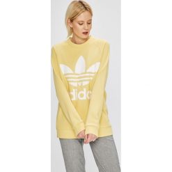 Adidas Originals - Bluza. Żółte bluzy damskie adidas Originals, z nadrukiem, z elastanu, bez rękawów, bez kaptura. W wyprzedaży za 249,90 zł.