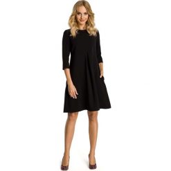 Czarna Sukienka Trapezowa z Kontrafałdą. Czarne sukienki koktajlowe marki Molly.pl, l, midi, oversize. Za 132,90 zł.