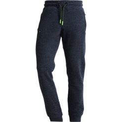 Superdry ORANGE LABEL HYPER POP Spodnie treningowe depths blue grit. Niebieskie spodnie dresowe męskie Superdry, z bawełny. Za 389,00 zł.