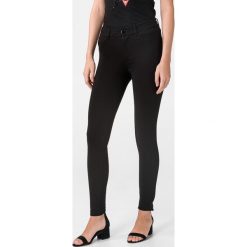 Guess Curve X Spodnie Czarny. Czarne spodnie damskie Guess, z aplikacjami, z elastanu. Za 312,95 zł.