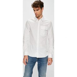 Calvin Klein Jeans - Koszula. Białe koszule męskie Calvin Klein Jeans, s, bez wzorów, z bawełny, klasyczne, z klasycznym kołnierzykiem, z długim rękawem. W wyprzedaży za 219,90 zł.