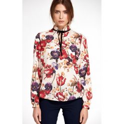 Elegancka bluzka w kwiaty - s. Bluzki damskie e-margeritka.pl, s, w kwiaty, z poliesteru, eleganckie, z krótkim rękawem, długie, bez kaptura. Za 118,99 zł.